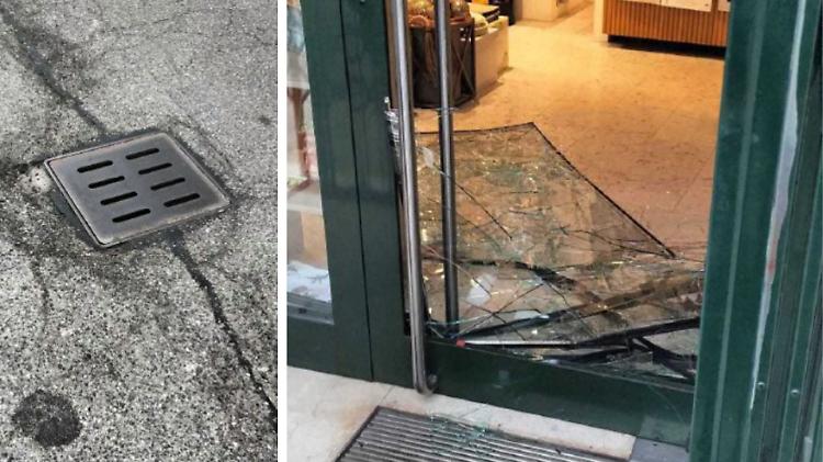 Spaccano la vetrina con un tombino e rubano il registratore di cassa